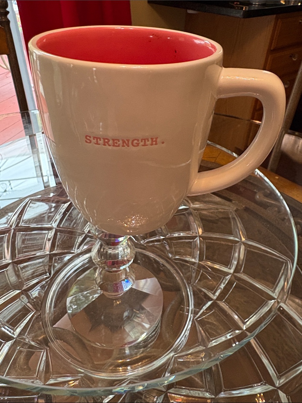 This is a Rae Dunn "STRENGTH." ceramic mug from the Artisan Collection by Magent